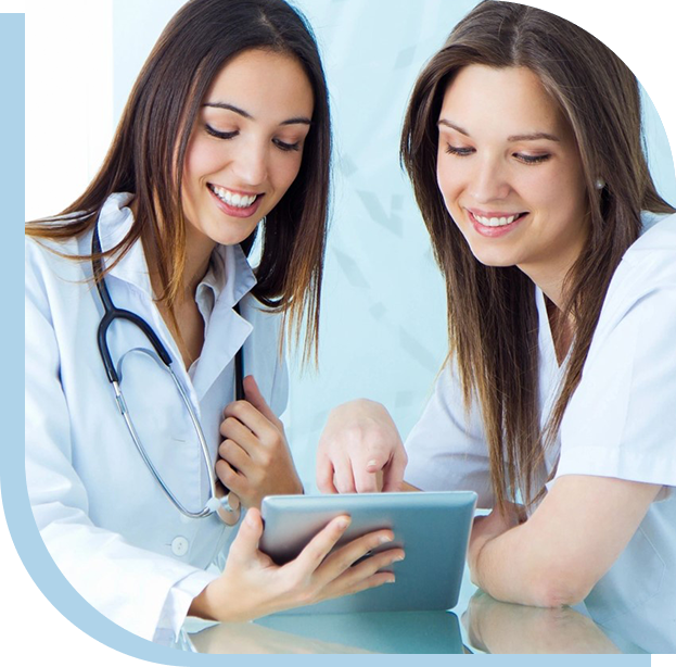 Two women are looking at a tablet.